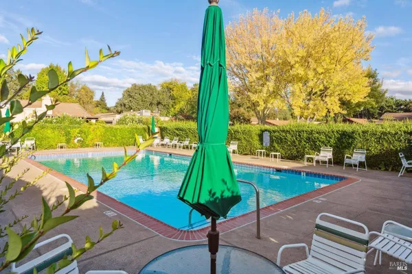 a view of a swimming pool with a patio