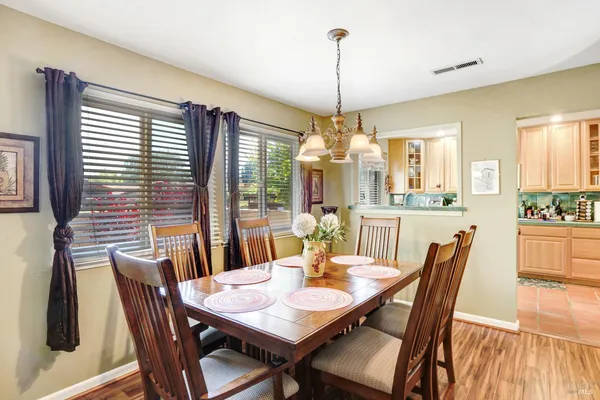 a view of a dining room with furniture window and outside view