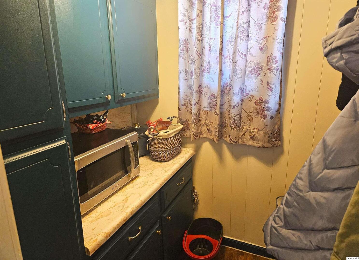 933 Adams Street Quincy, IL 62301 - Photo 13 of 26 a bathroom with a sink and a mirror