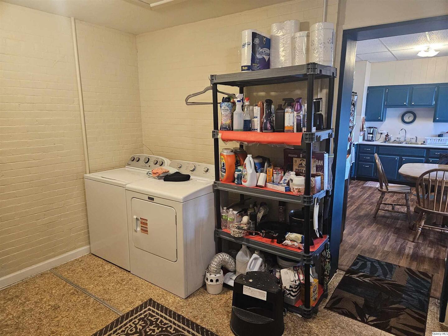 933 Adams Street Quincy, IL 62301 - Photo 14 of 26 a storage room with washer and dryer