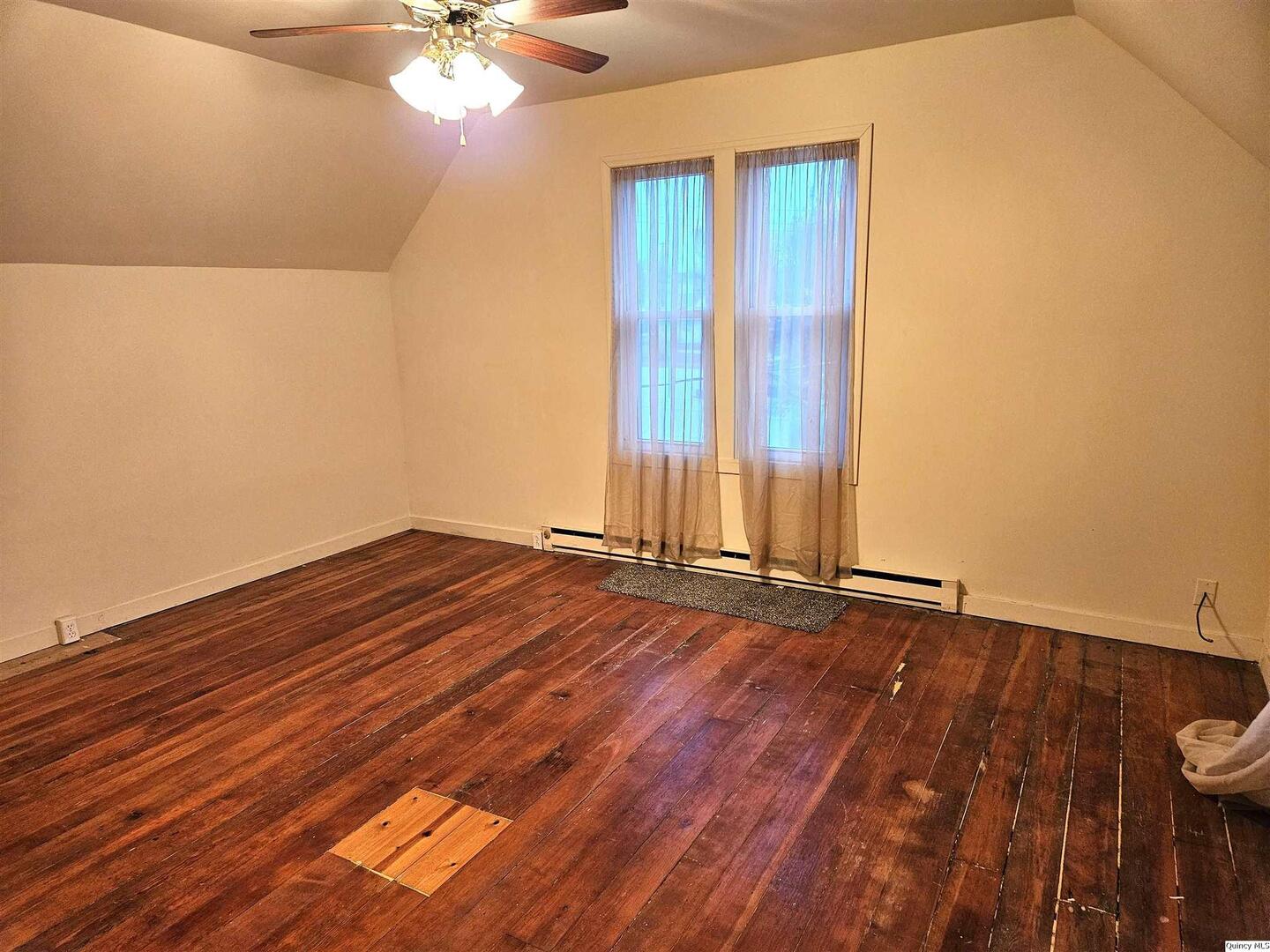 933 Adams Street Quincy, IL 62301 - Photo 24 of 26 wooden floor in an empty room with a window