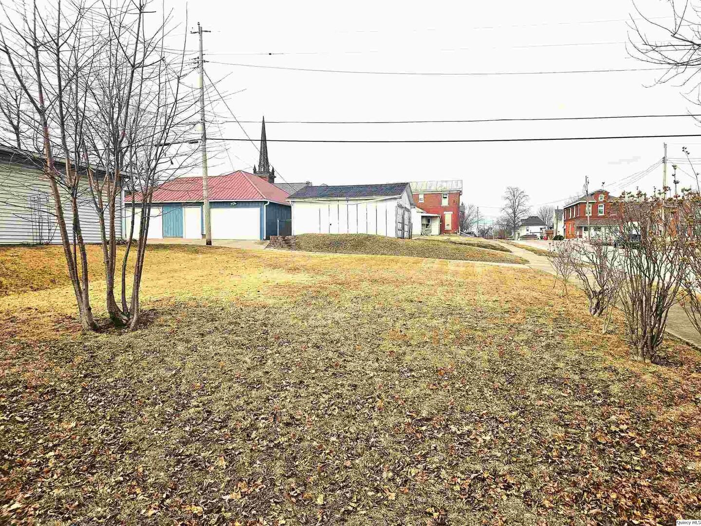 933 Adams Street Quincy, IL 62301 - Photo 8 of 26 a view of a lake with a building in the background