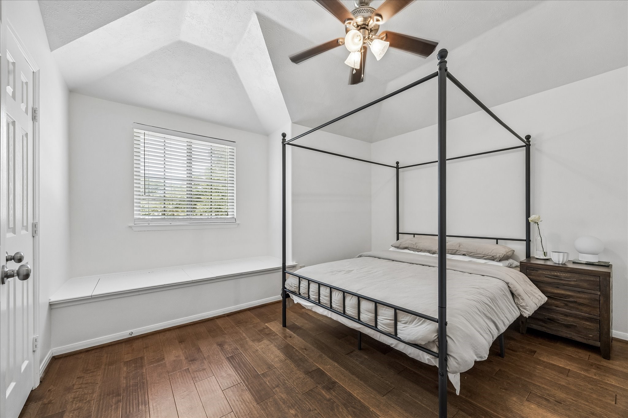 5811 Walkabout Way Katy, TX 77450 - Photo 23 of 33 Charming secondary bedroom with vaulted ceilings and warm hardwood floors.