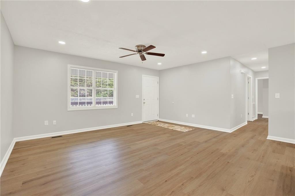 76 Picklesimer Road Southwest Cartersville, GA 30120 - Photo 8 of 43 wooden floor in an empty room with a window