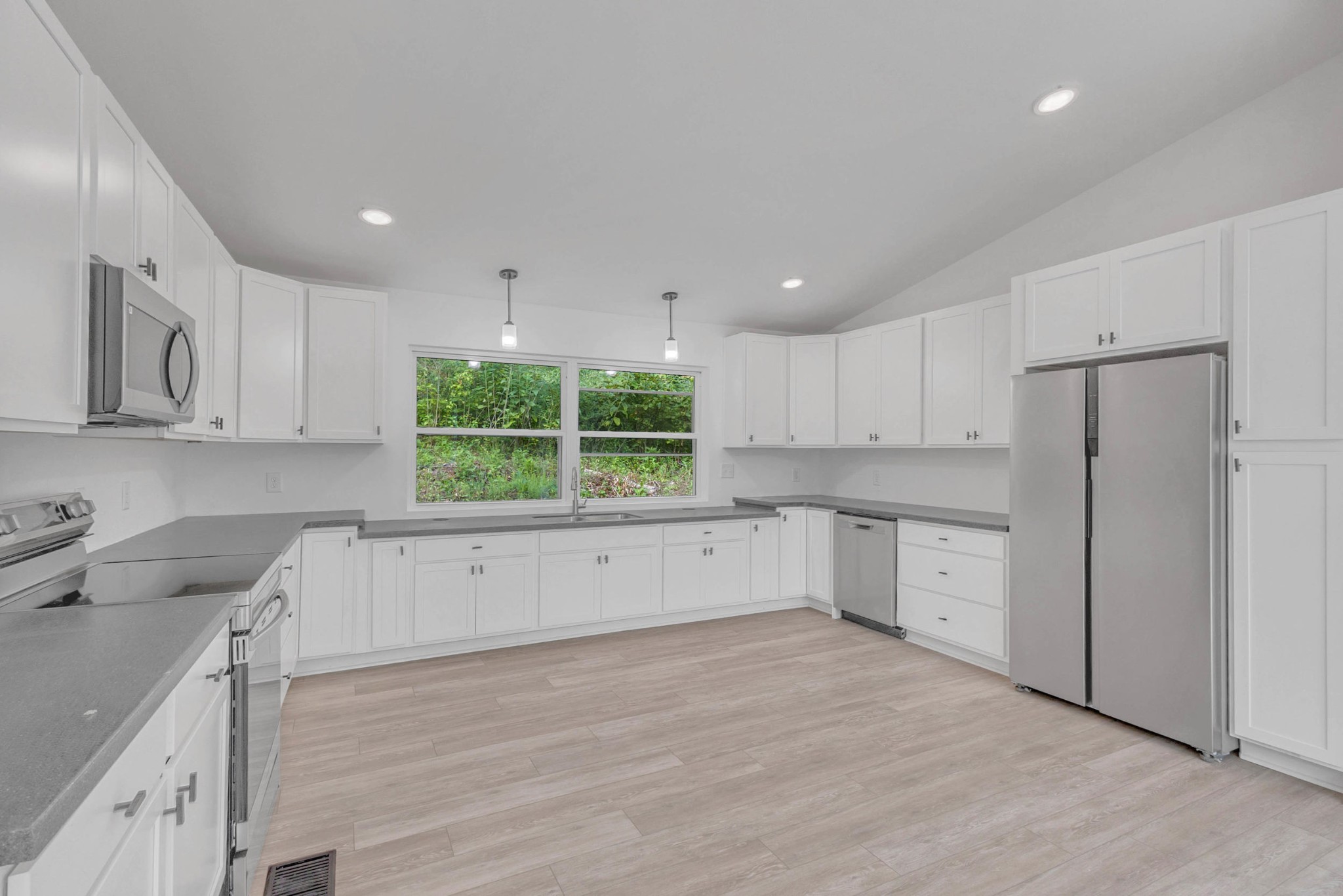 515 Big Branch Road Granville, TN 38564 - Photo 15 of 76 a kitchen with a refrigerator a sink and cabinets