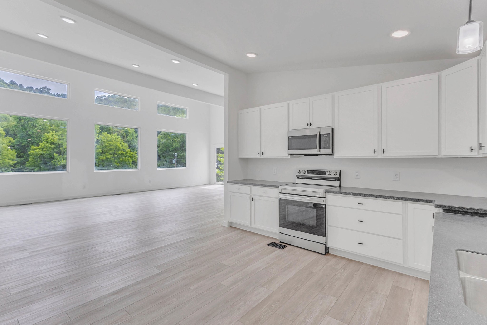 515 Big Branch Road Granville, TN 38564 - Photo 18 of 76 a kitchen with granite countertop white cabinets and appliances