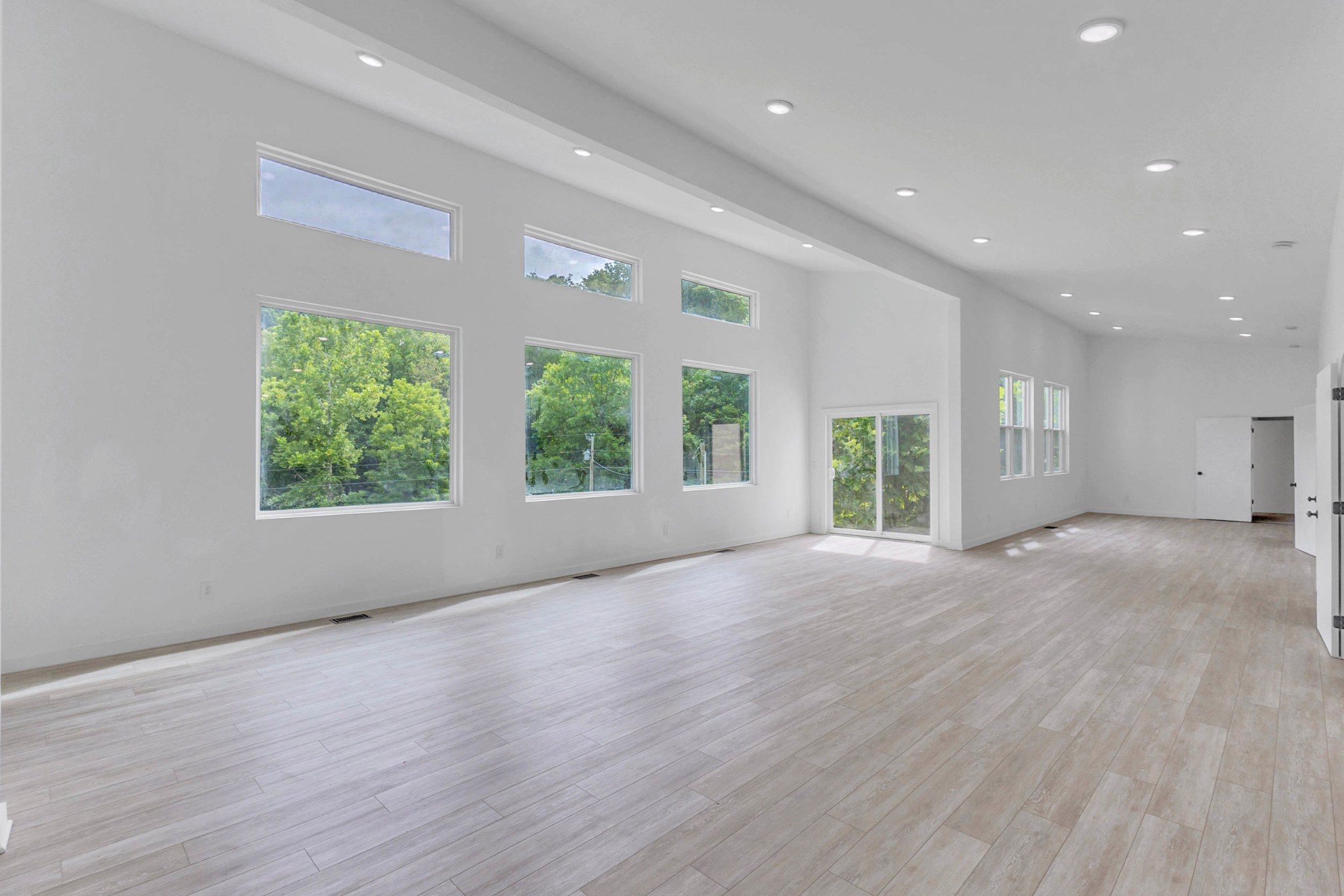 515 Big Branch Road Granville, TN 38564 - Photo 21 of 76 an empty room with wooden floor and windows