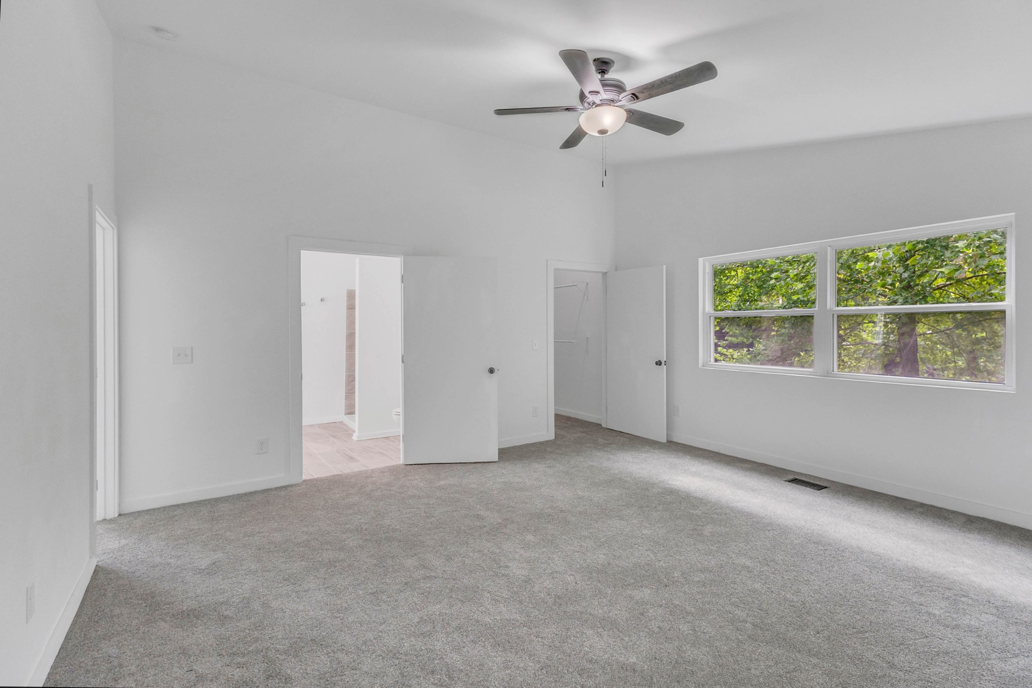 515 Big Branch Road Granville, TN 38564 - Photo 33 of 76 an empty room with windows and ceiling fan