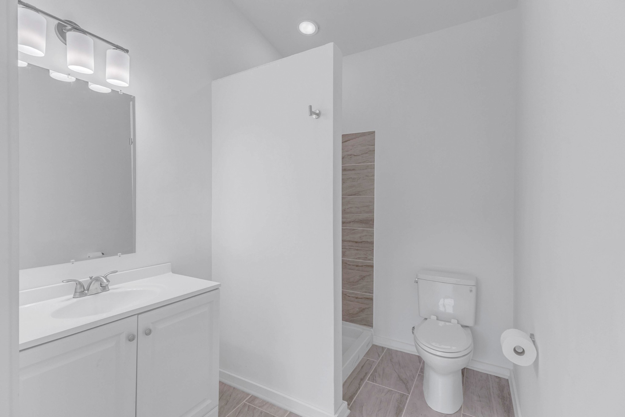 515 Big Branch Road Granville, TN 38564 - Photo 41 of 76 a bathroom with a toilet sink and a mirror