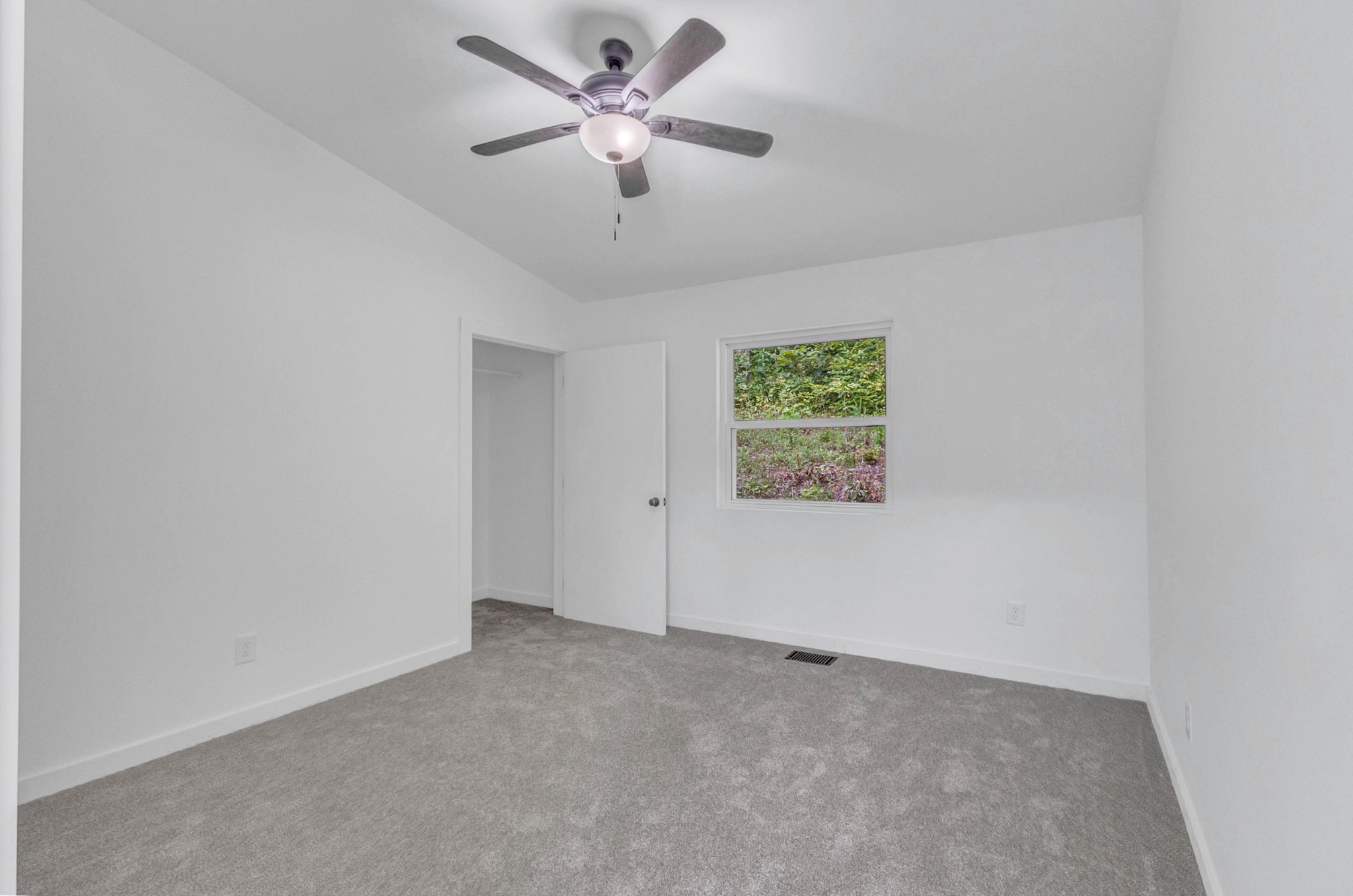 515 Big Branch Road Granville, TN 38564 - Photo 44 of 76 an empty room with a window and a fan