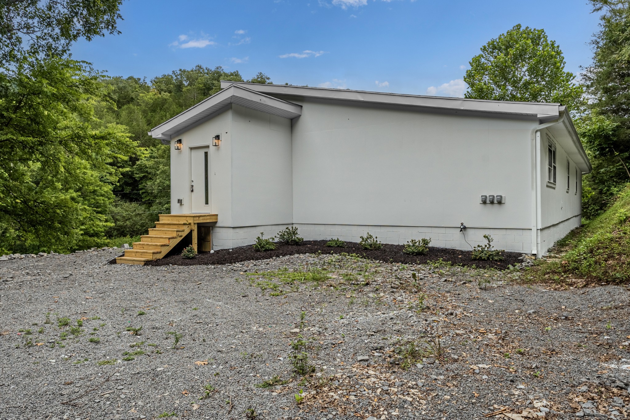 515 Big Branch Road Granville, TN 38564 - Photo 8 of 76 a house with trees in the background