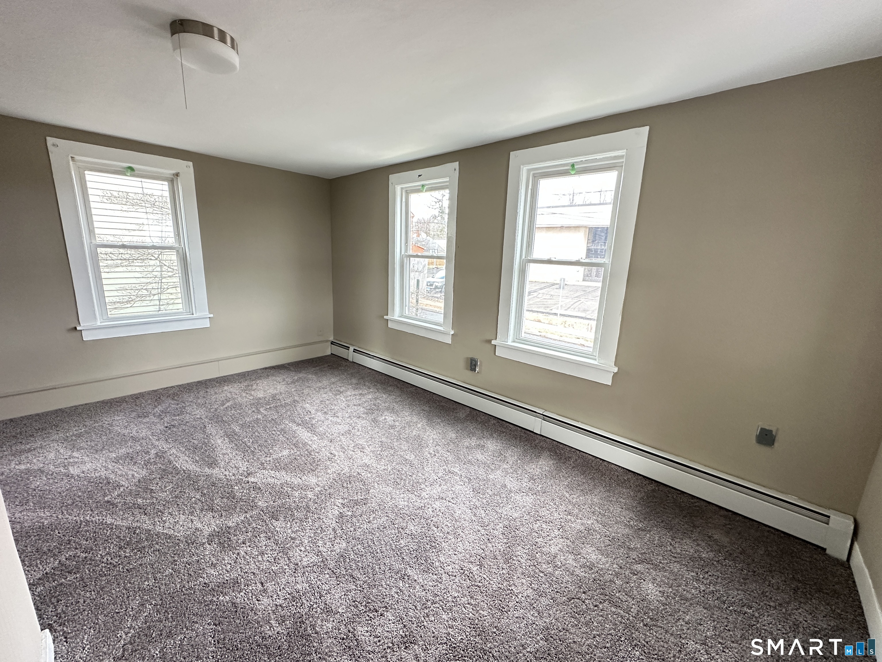 40 Oak Street, Unit 1 Windsor Locks, CT 06096 - Photo 12 of 21 a view of an empty room with a window