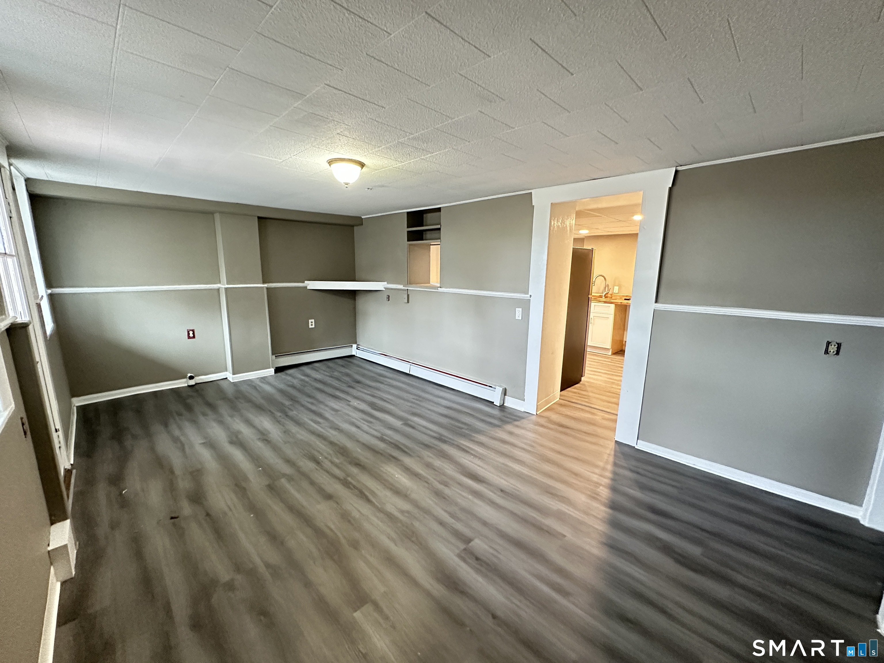 40 Oak Street, Unit 1 Windsor Locks, CT 06096 - Photo 4 of 21 a view of an empty room with wooden floor