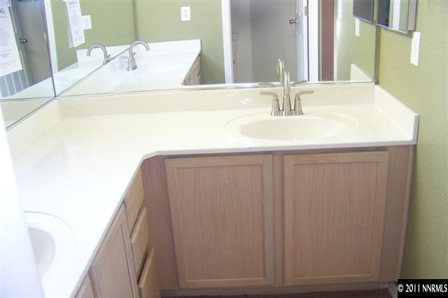 1700 Northrup Court Reno, NV 89521 - Photo 11 of 11 a bathroom with a sink and a mirror