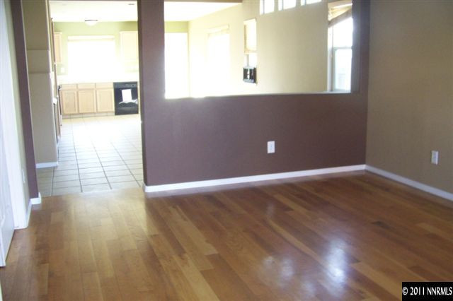 1700 Northrup Court Reno, NV 89521 - Photo 4 of 11 a view of an empty room with wooden floor and a window