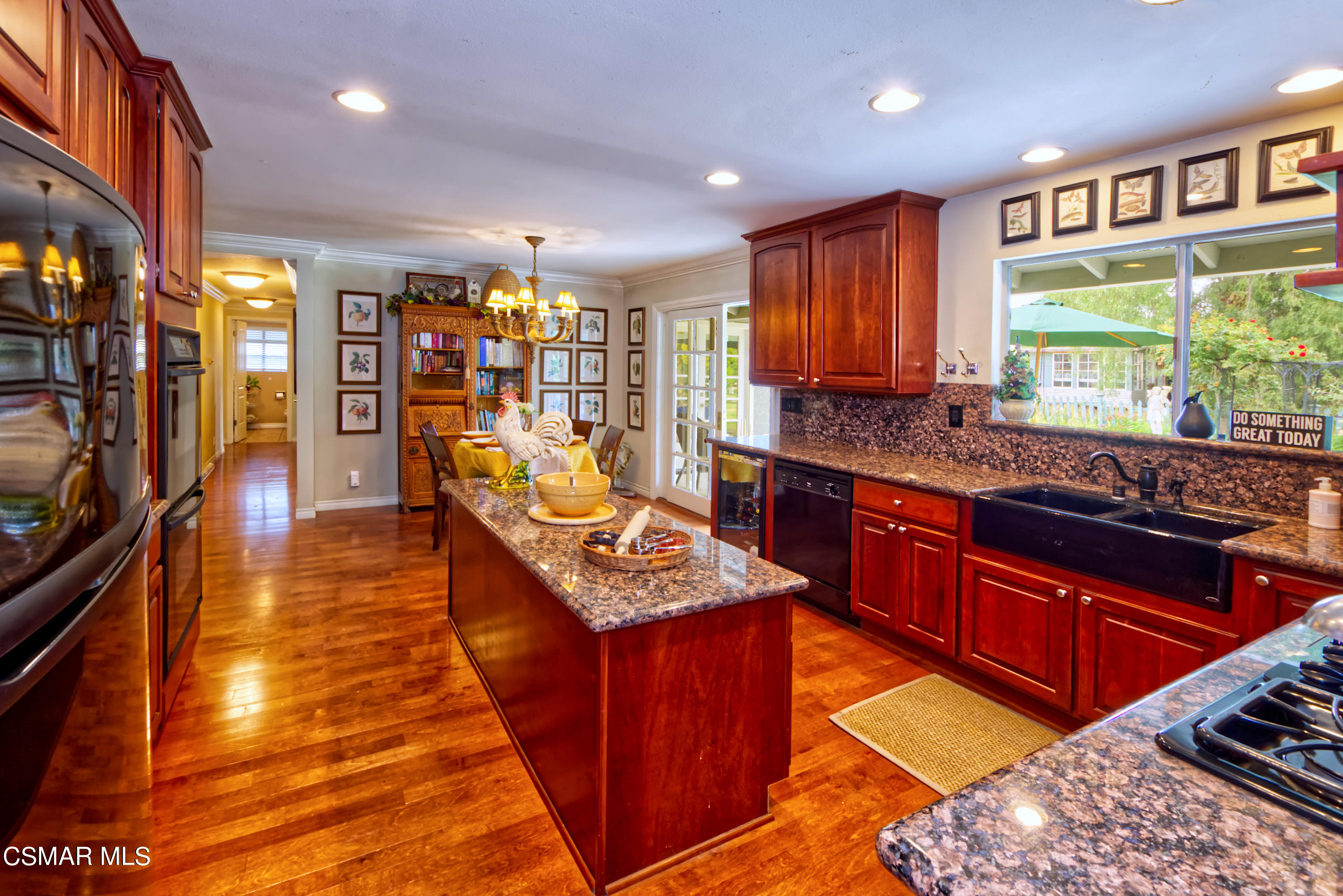 4888 Mira Sol Drive Moorpark, CA 93021 - Photo 11 of 39 a kitchen with stainless steel appliances granite countertop a stove a sink dishwasher and a refrigerator