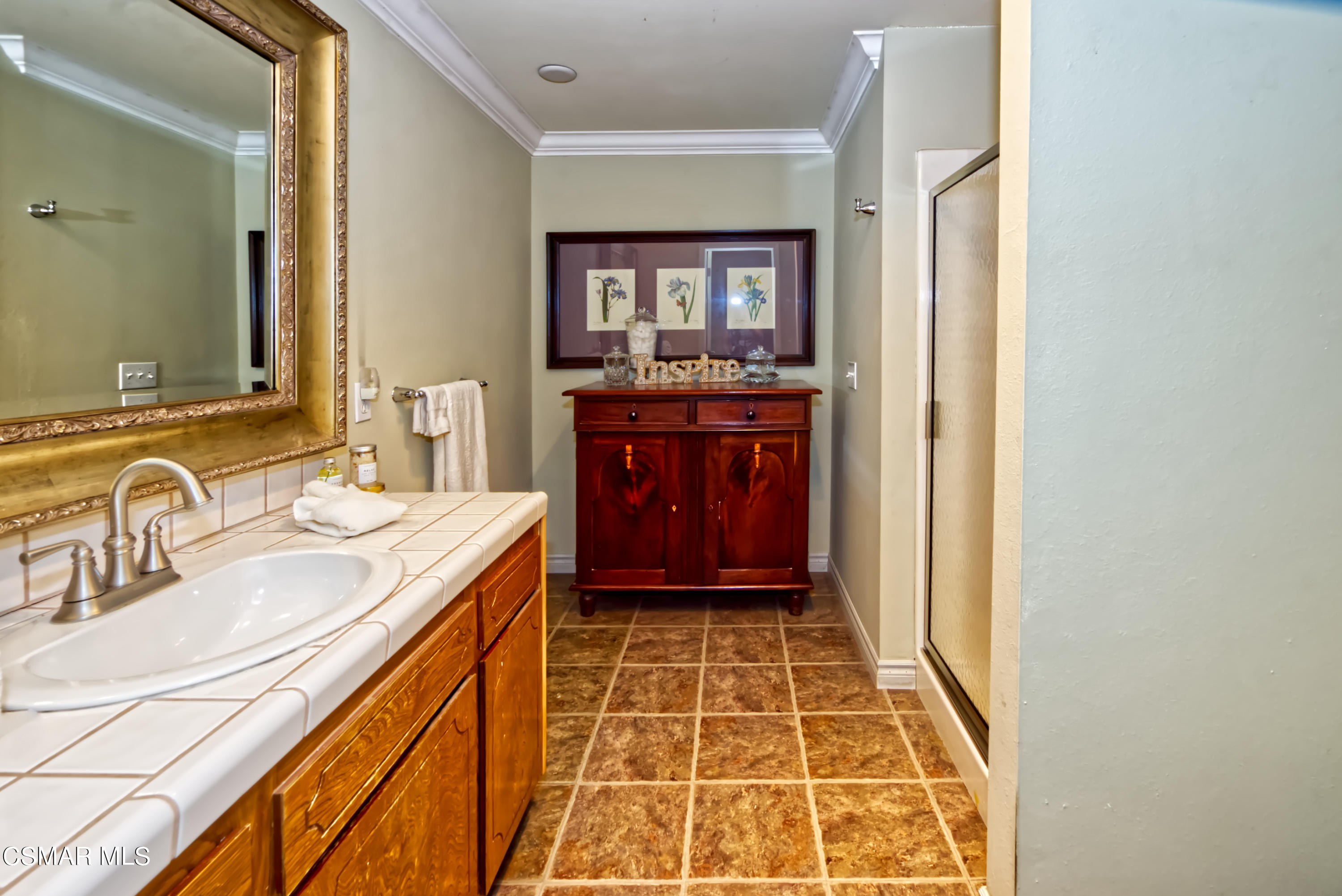 4888 Mira Sol Drive Moorpark, CA 93021 - Photo 20 of 39 a bathroom with a sink and a mirror