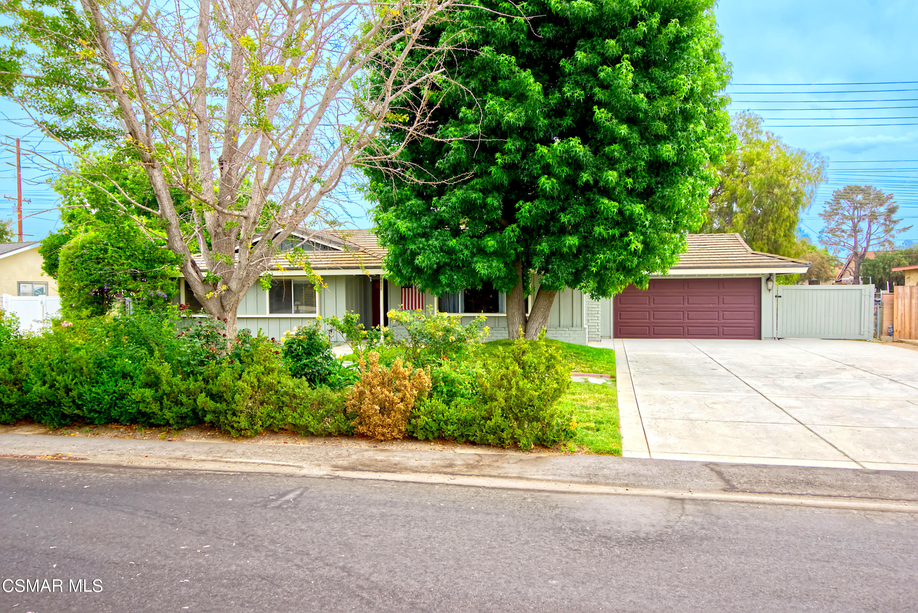 4888 Mira Sol Drive Moorpark, CA 93021 - Photo 3 of 39 a front view of a house with a yard and a garden