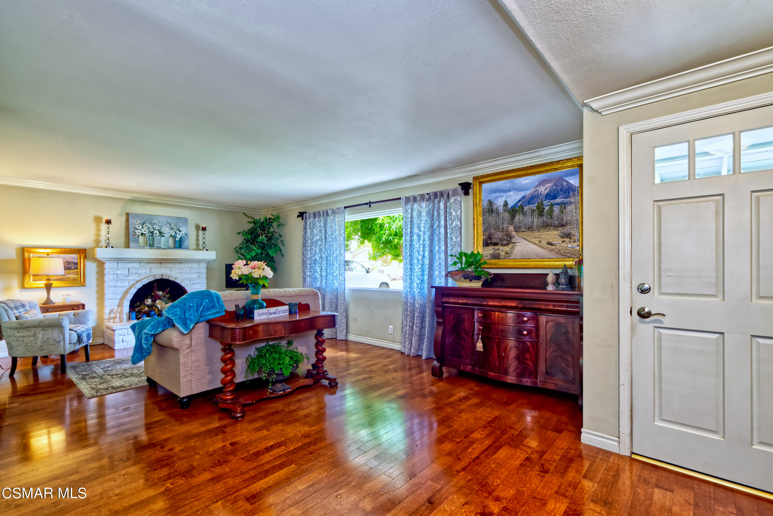 4888 Mira Sol Drive Moorpark, CA 93021 - Photo 7 of 39 a living room with furniture and a flat screen tv