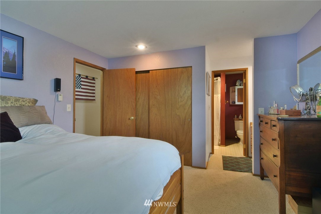 7709 Upper Ridge Road Everett, WA 98203 - Photo 14 of 24 a bedroom with a bed and cabinets
