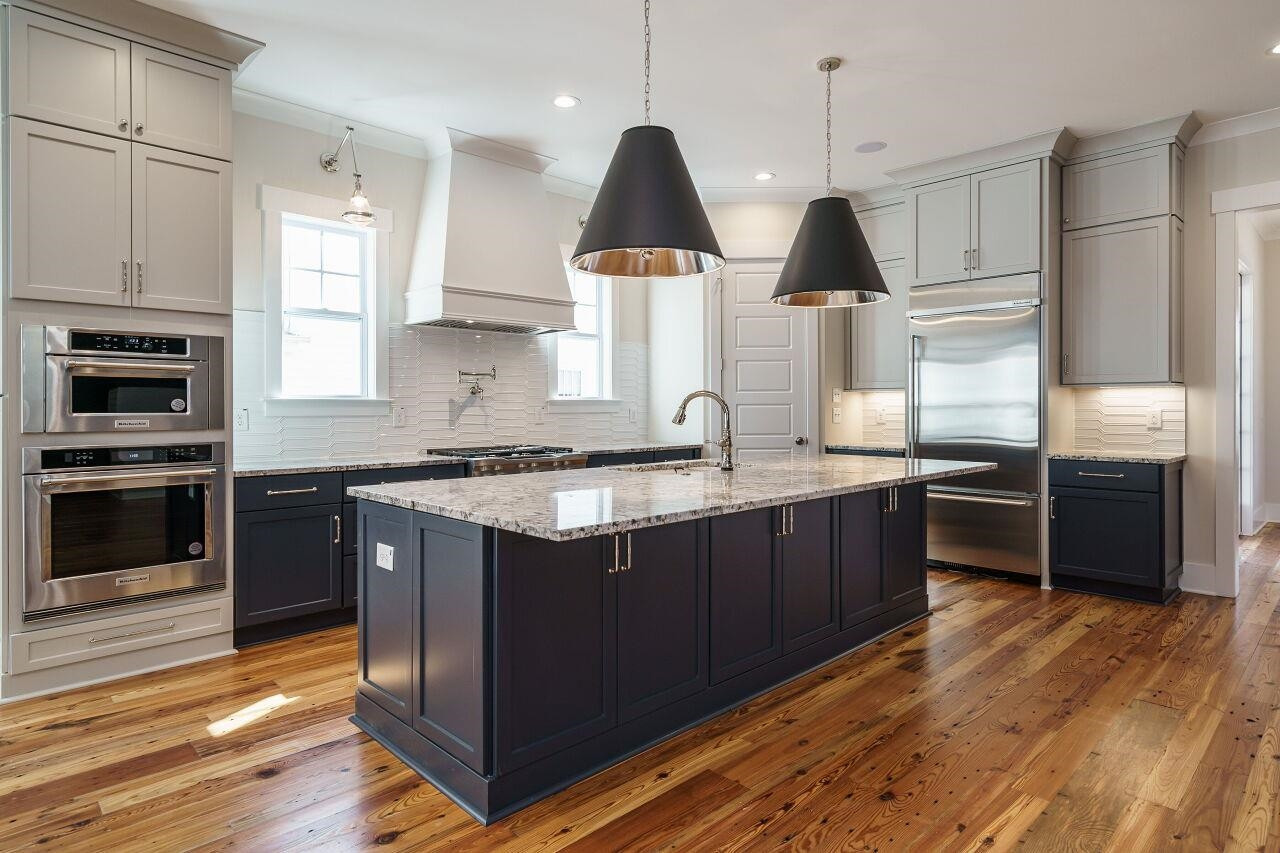 213 Georgetown Road Raleigh, NC 27608 - Photo 1 of 44 a kitchen with stainless steel appliances granite countertop a refrigerator a stove a sink dishwasher and a microwave oven with large wooden cabinets
