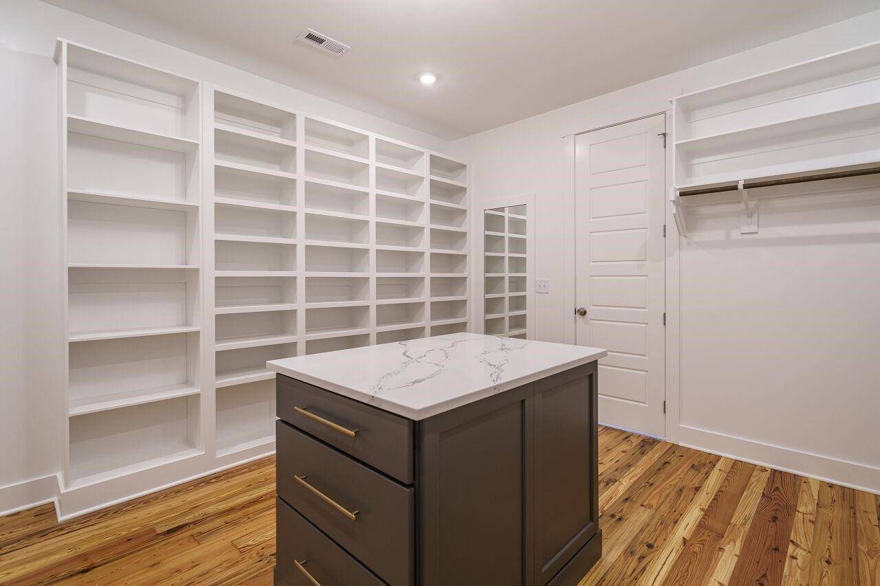 213 Georgetown Road Raleigh, NC 27608 - Photo 18 of 44 a room with a wooden floor and a window