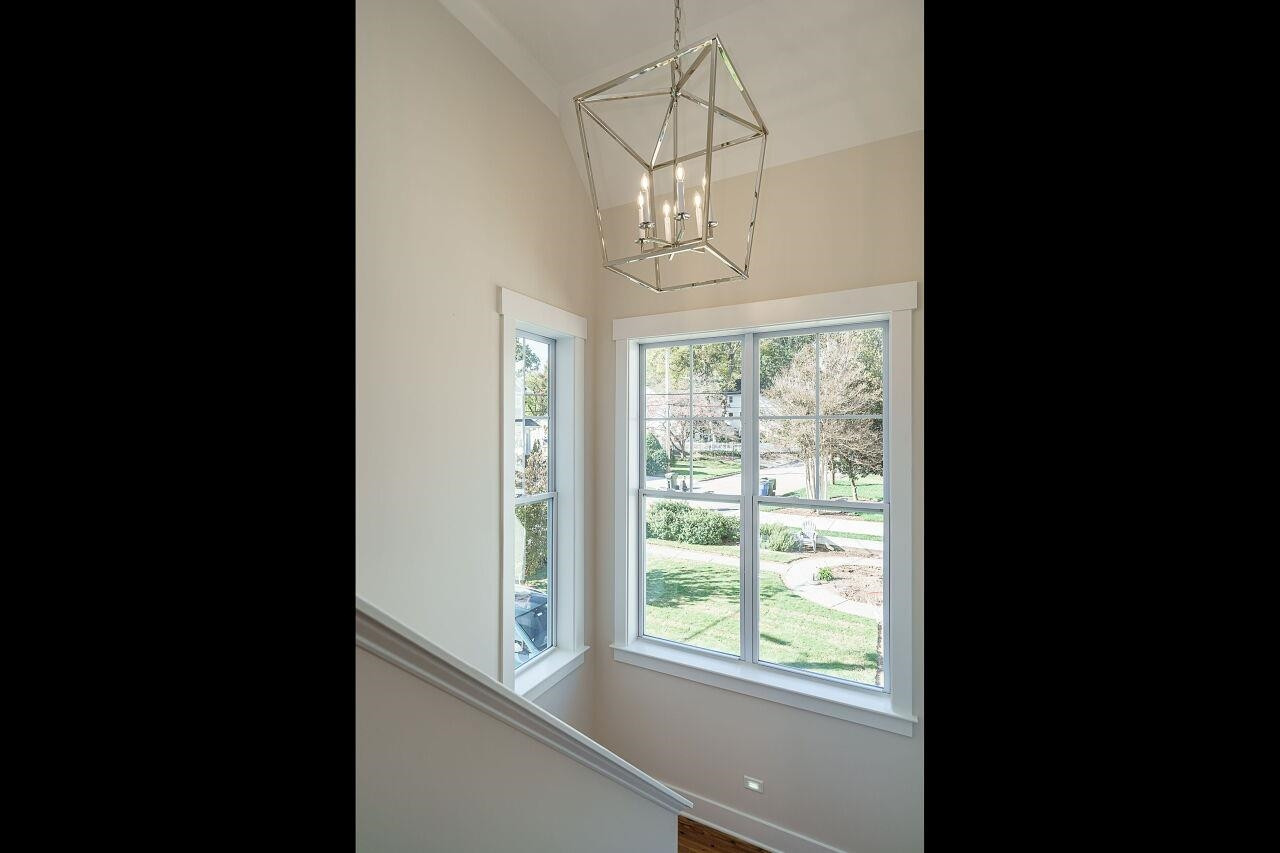 213 Georgetown Road Raleigh, NC 27608 - Photo 20 of 44 a view of a livingroom with wooden floor and a window