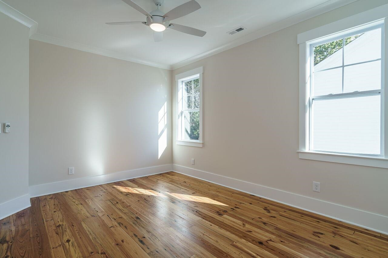 213 Georgetown Road Raleigh, NC 27608 - Photo 27 of 44 wooden floor in an empty room with a window
