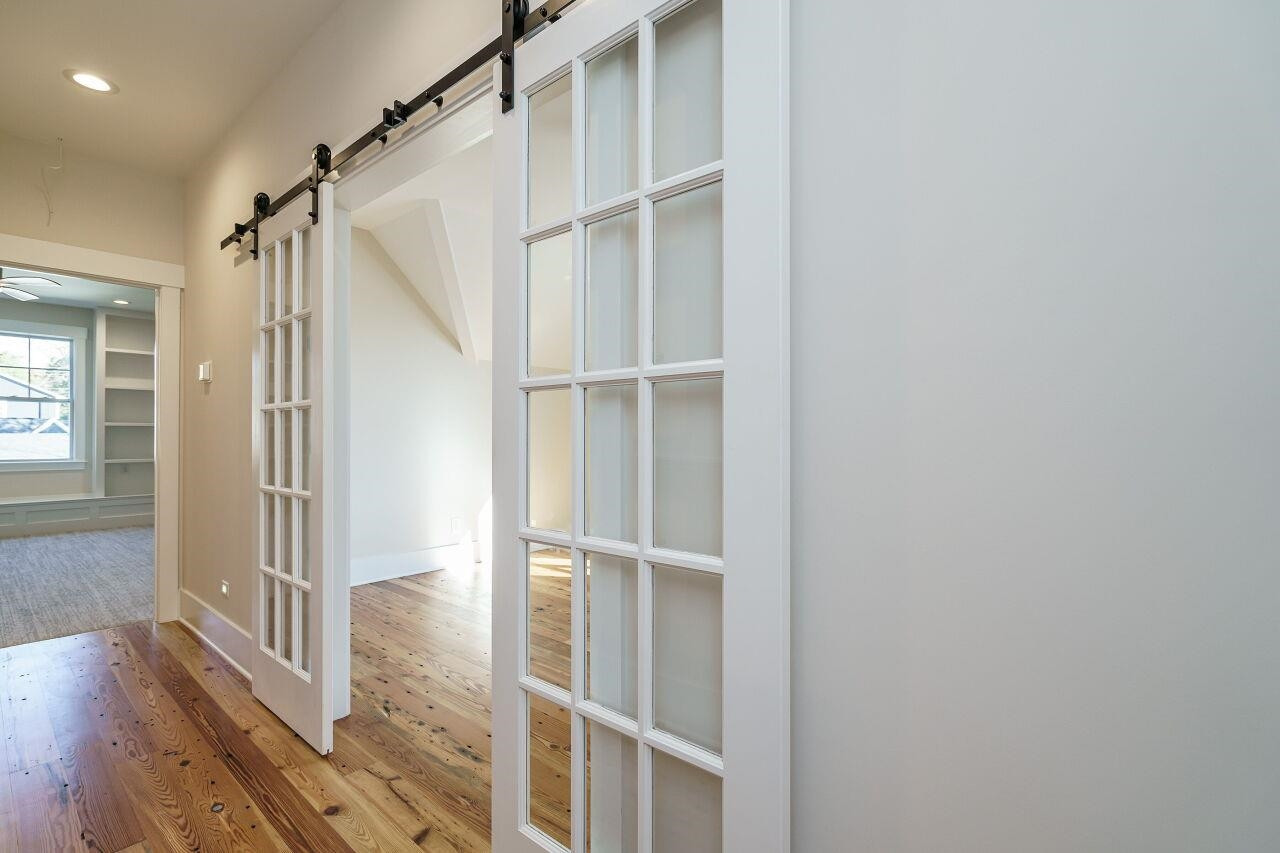 213 Georgetown Road Raleigh, NC 27608 - Photo 28 of 44 a view of entryway with wooden floor and door