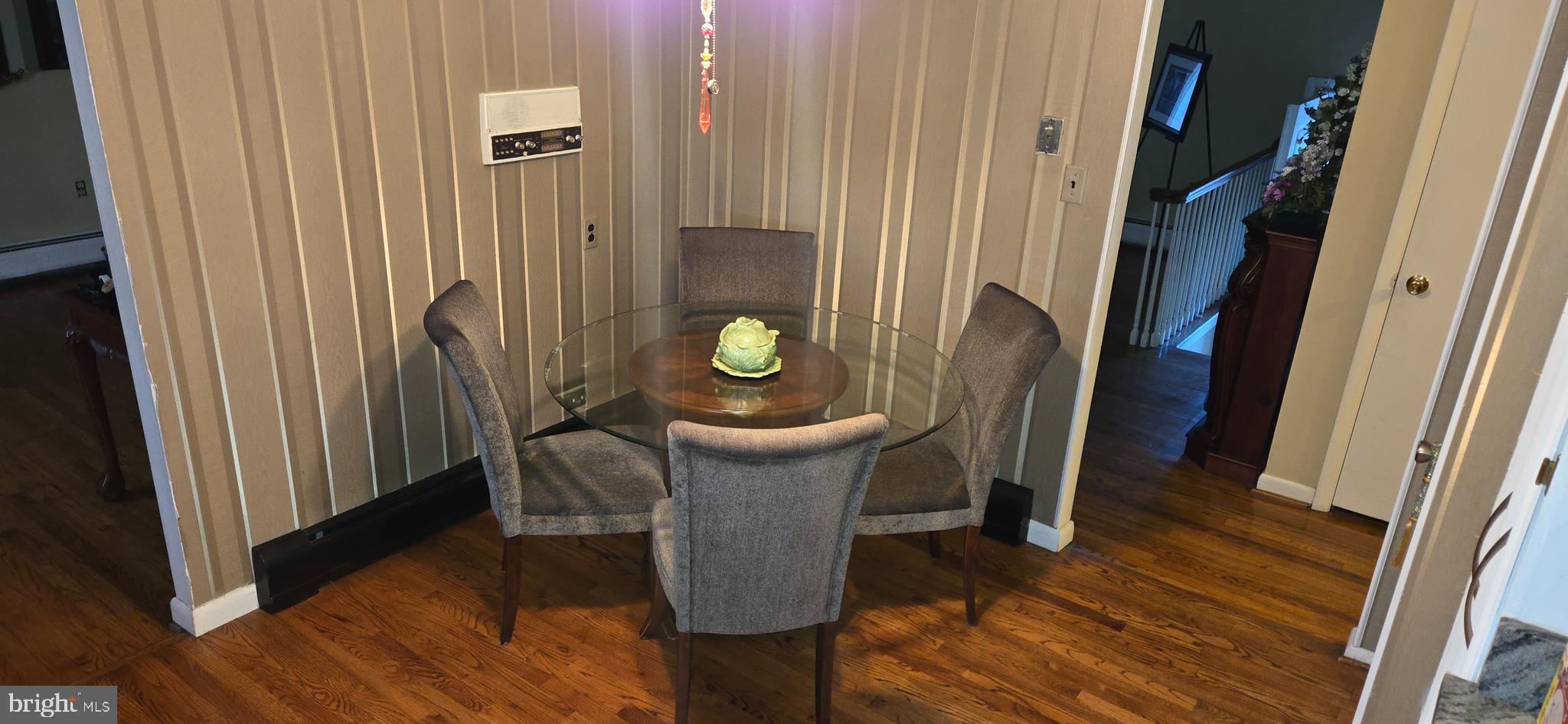 11507 Keystone Avenue Clinton, MD 20735 - Photo 11 of 33 a view of a hallway with furniture and wooden floor