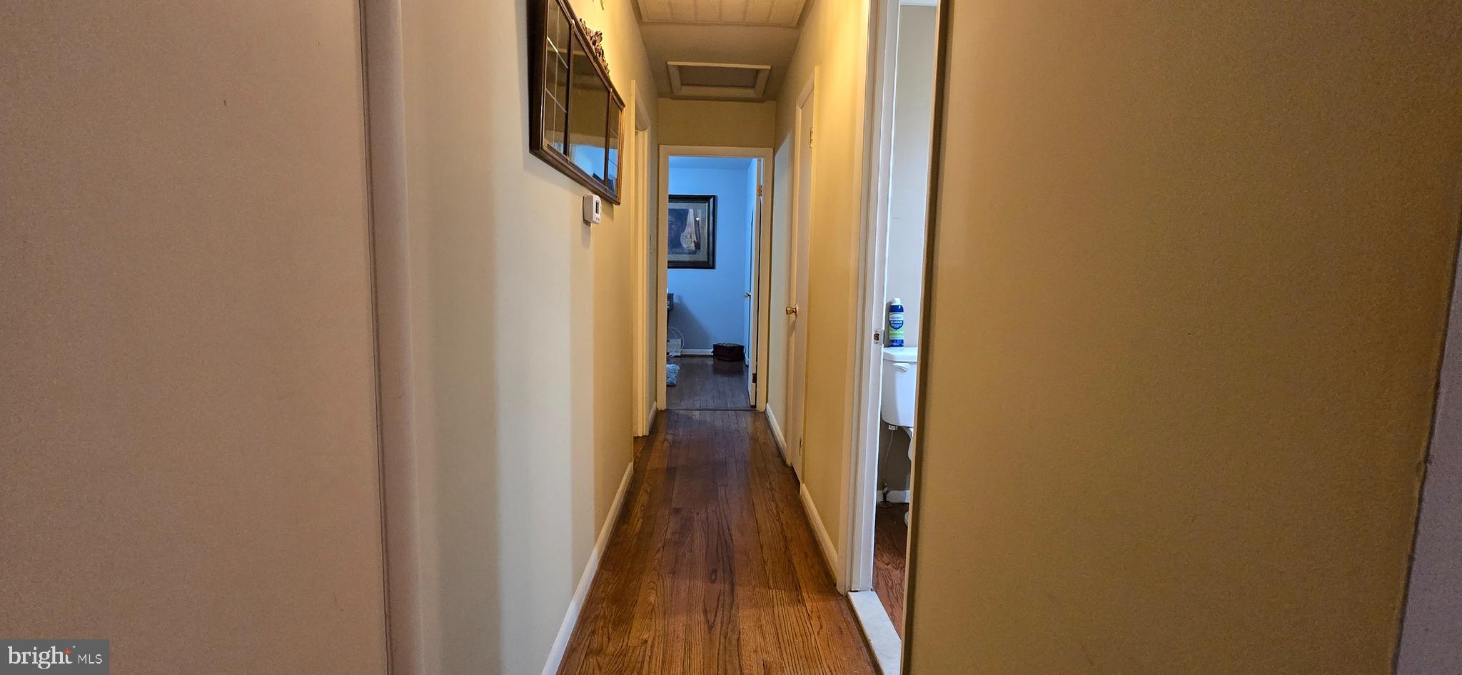 11507 Keystone Avenue Clinton, MD 20735 - Photo 12 of 33 a view of a hallway with wooden floor and a door