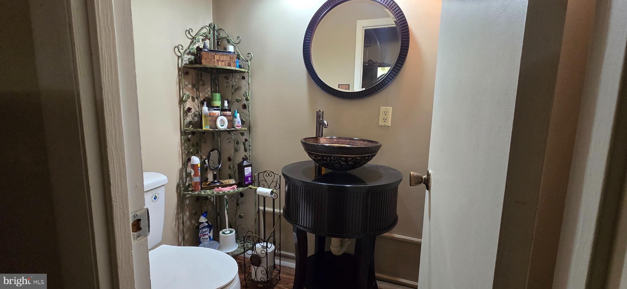 11507 Keystone Avenue Clinton, MD 20735 - Photo 13 of 33 a bathroom with a toilet and a mirror