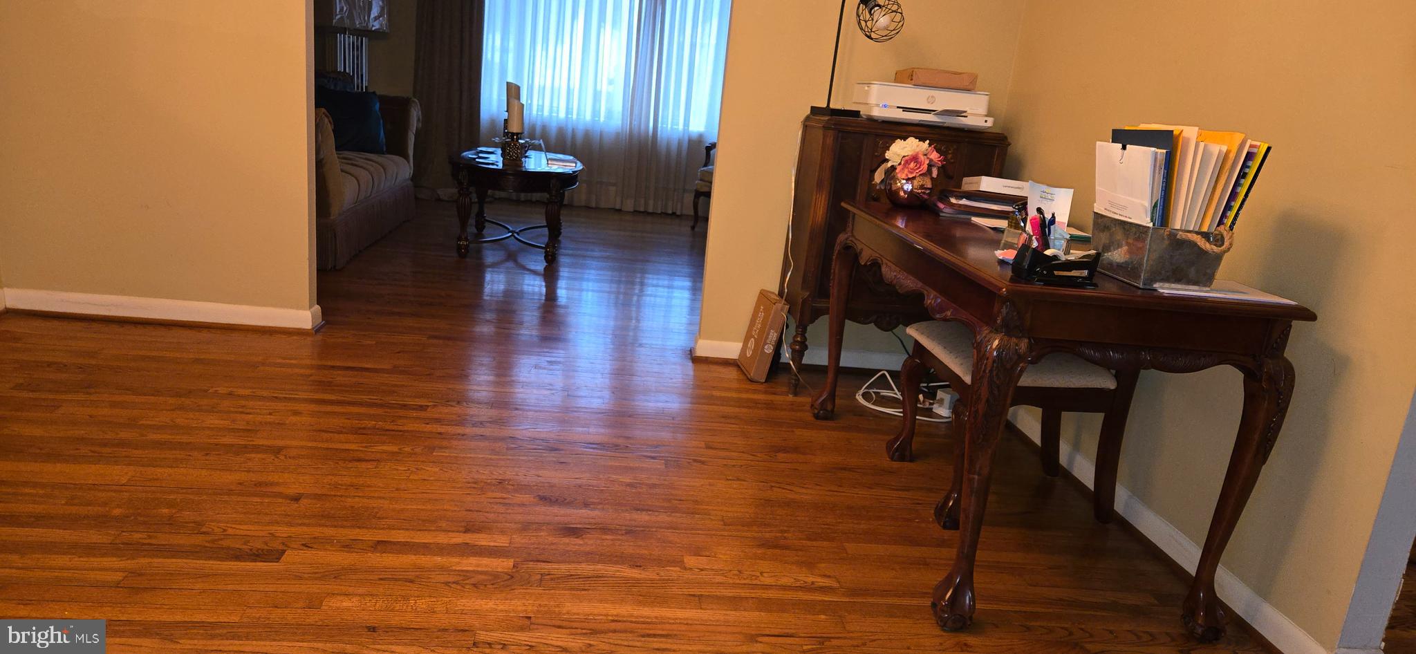 11507 Keystone Avenue Clinton, MD 20735 - Photo 17 of 33 a view of a hallway with wooden floor