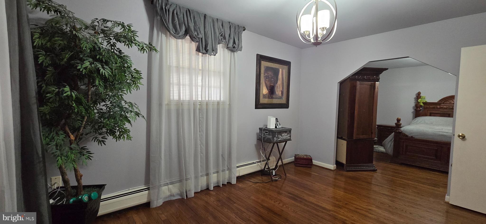 11507 Keystone Avenue Clinton, MD 20735 - Photo 20 of 33 a view of livingroom with furniture and wooden floor