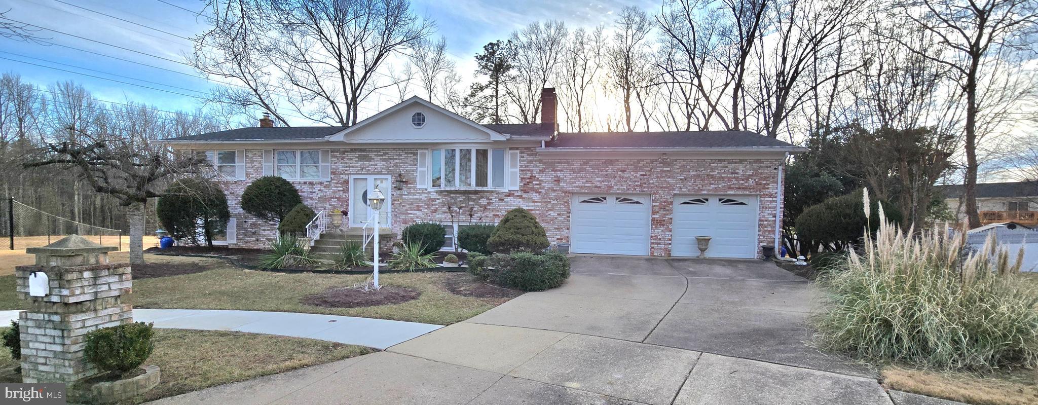 11507 Keystone Avenue Clinton, MD 20735 - Photo 2 of 33 a front view of a house with garden