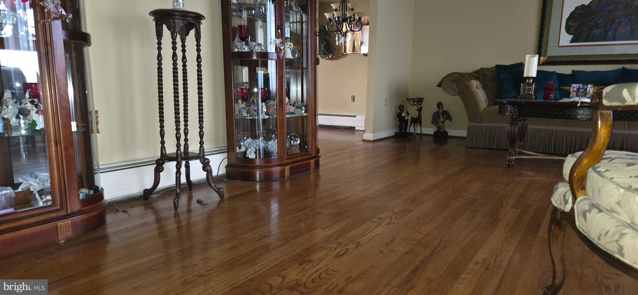 11507 Keystone Avenue Clinton, MD 20735 - Photo 4 of 33 a living room with furniture and wooden floor