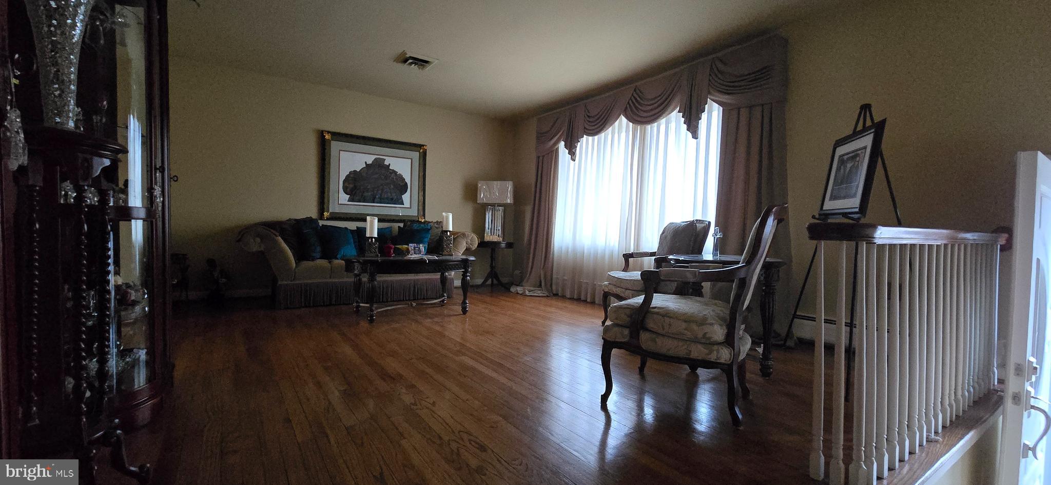 11507 Keystone Avenue Clinton, MD 20735 - Photo 5 of 33 a living room with furniture and a flat screen tv