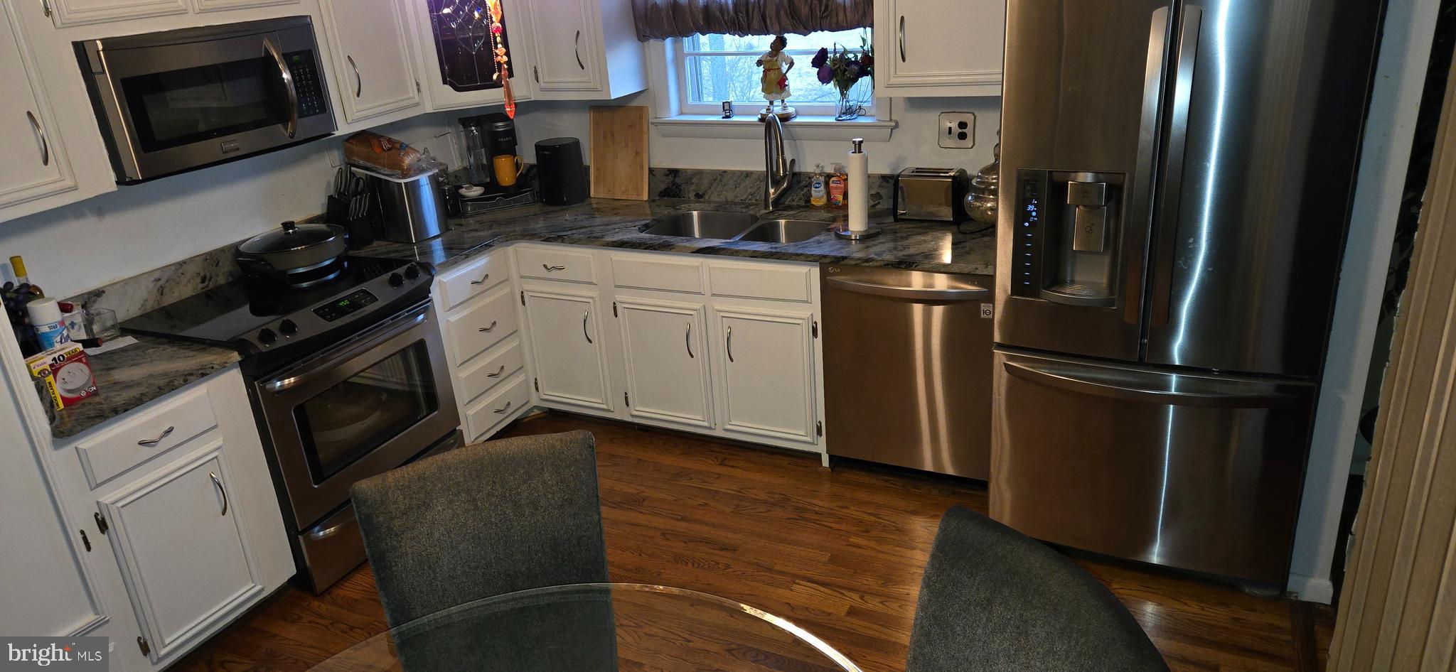 11507 Keystone Avenue Clinton, MD 20735 - Photo 10 of 33 a kitchen with stainless steel appliances a refrigerator stove and sink