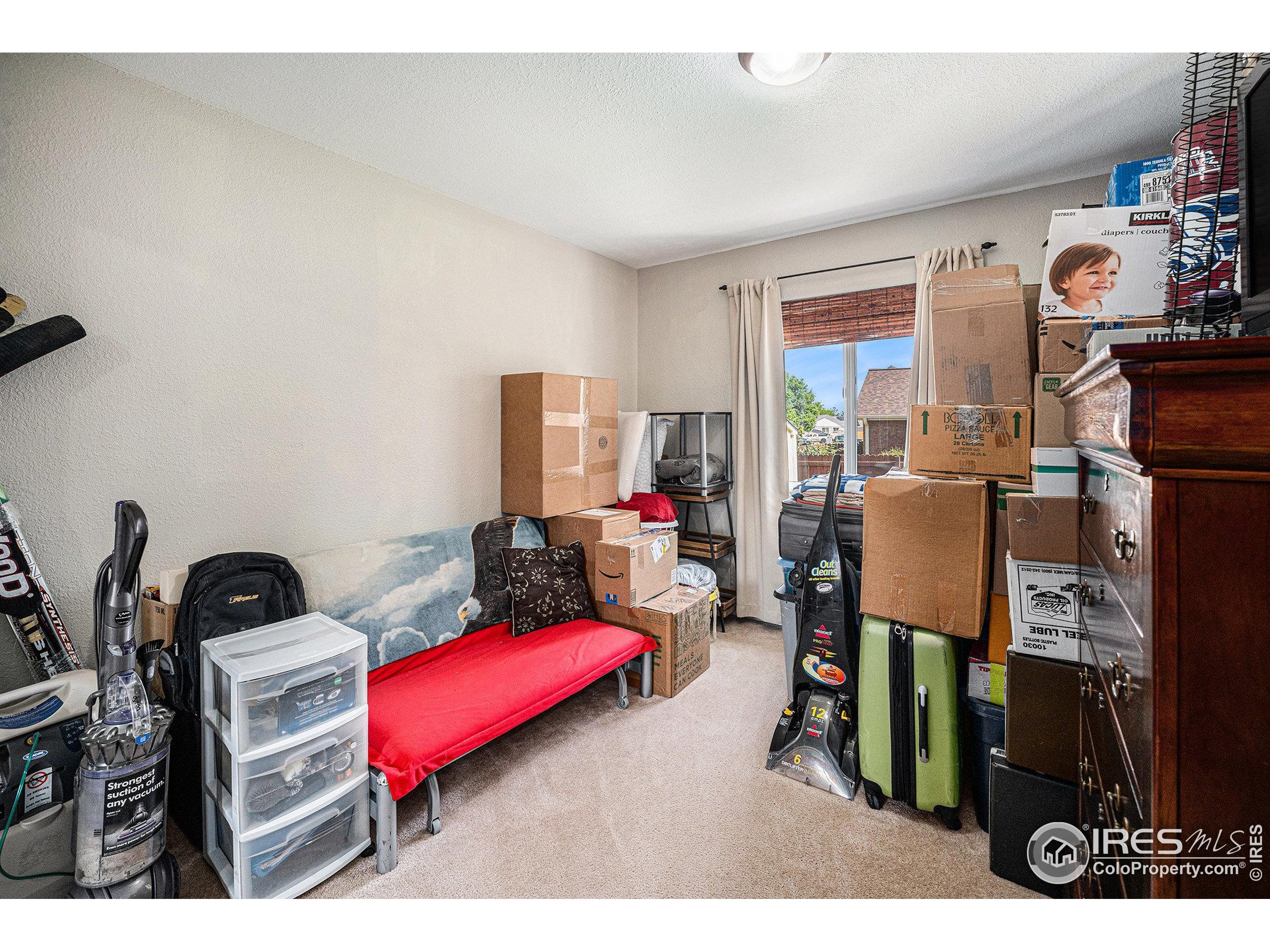1030 South Fulton Avenue Fort Lupton, CO 80621 - Photo 13 of 26 a living room with furniture a flat screen tv and a table