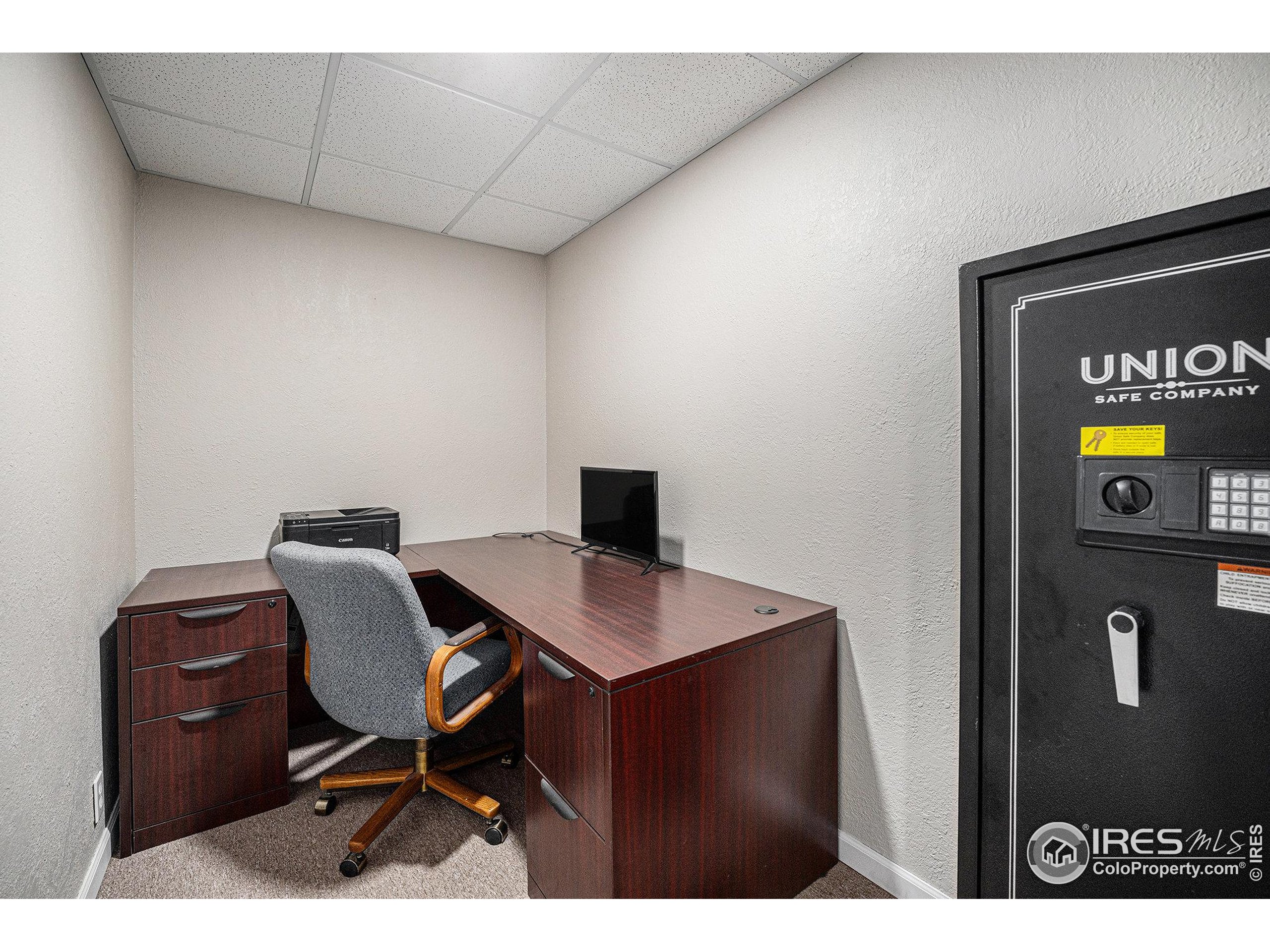 1030 South Fulton Avenue Fort Lupton, CO 80621 - Photo 17 of 26 a view of a workspace with furniture
