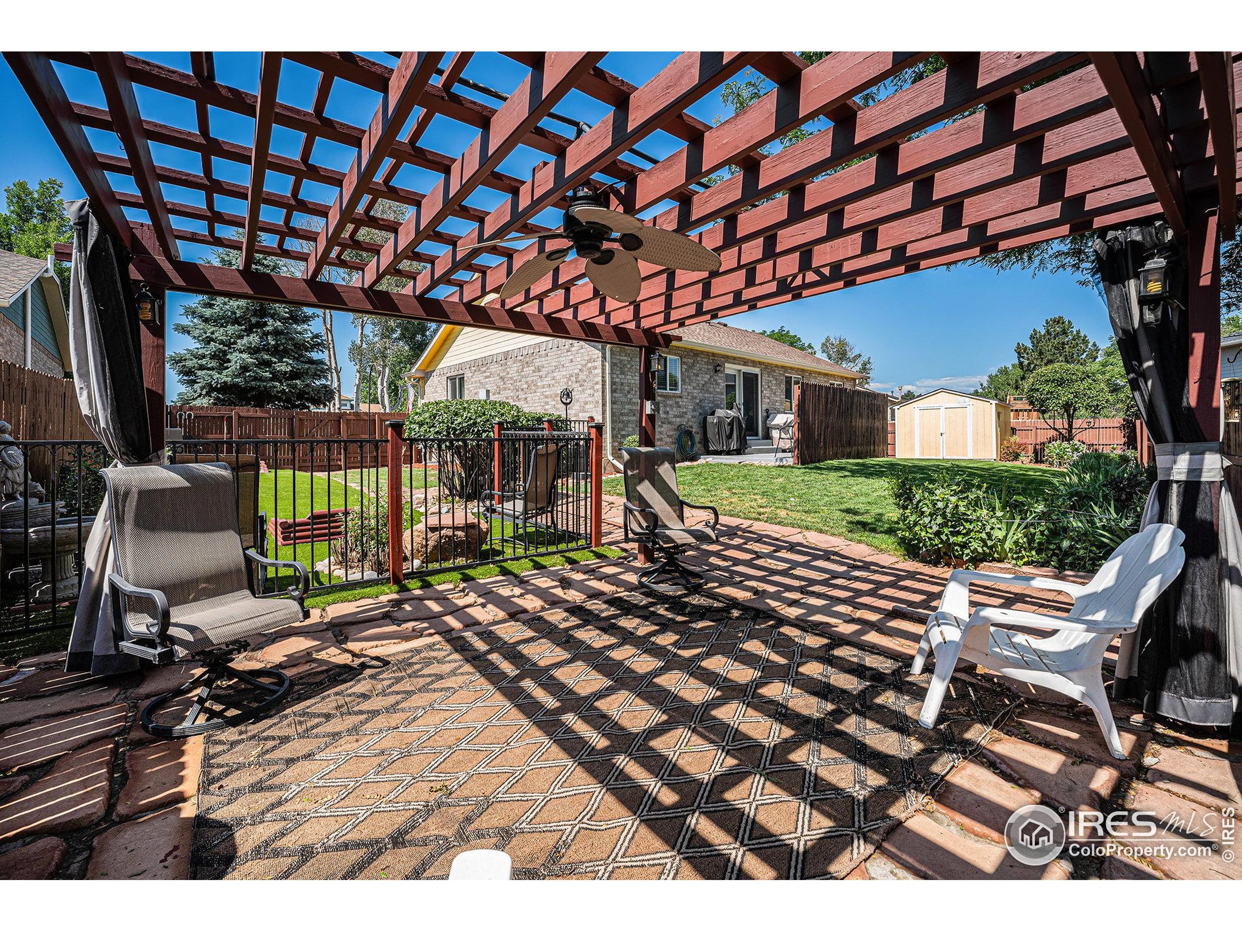 1030 South Fulton Avenue Fort Lupton, CO 80621 - Photo 19 of 26 a view of a patio with wooden floor