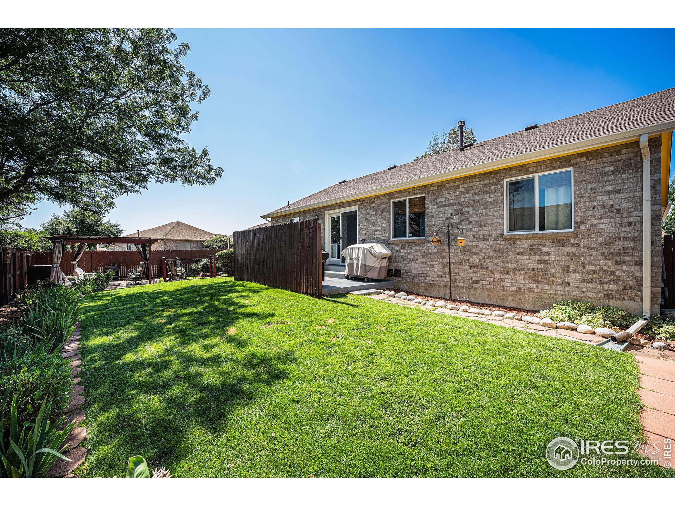 1030 South Fulton Avenue Fort Lupton, CO 80621 - Photo 20 of 26 a front view of a house with a yard
