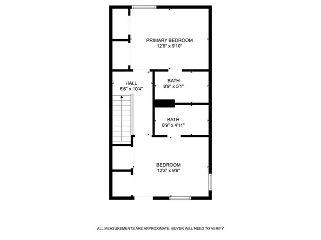 an aerial view of residential houses with outdoor space and parking