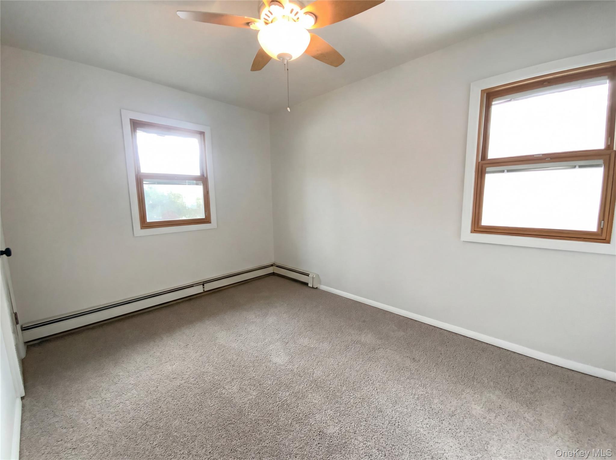 269 Prince Road Brookhaven, NY 11778 - Photo 14 of 22 an empty room with a window