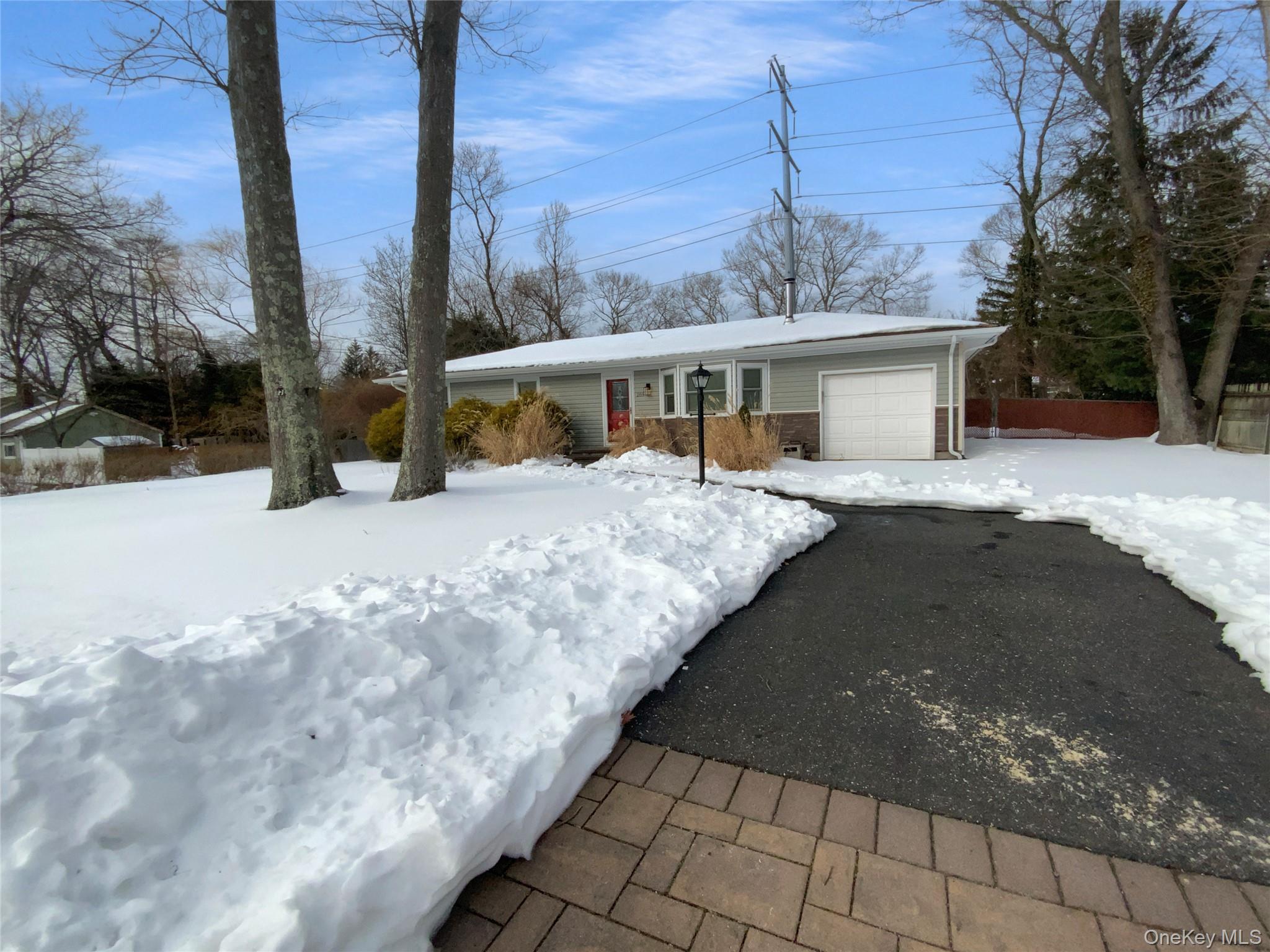 269 Prince Road Brookhaven, NY 11778 - Photo 20 of 22 a view of a house with a snow in the yard