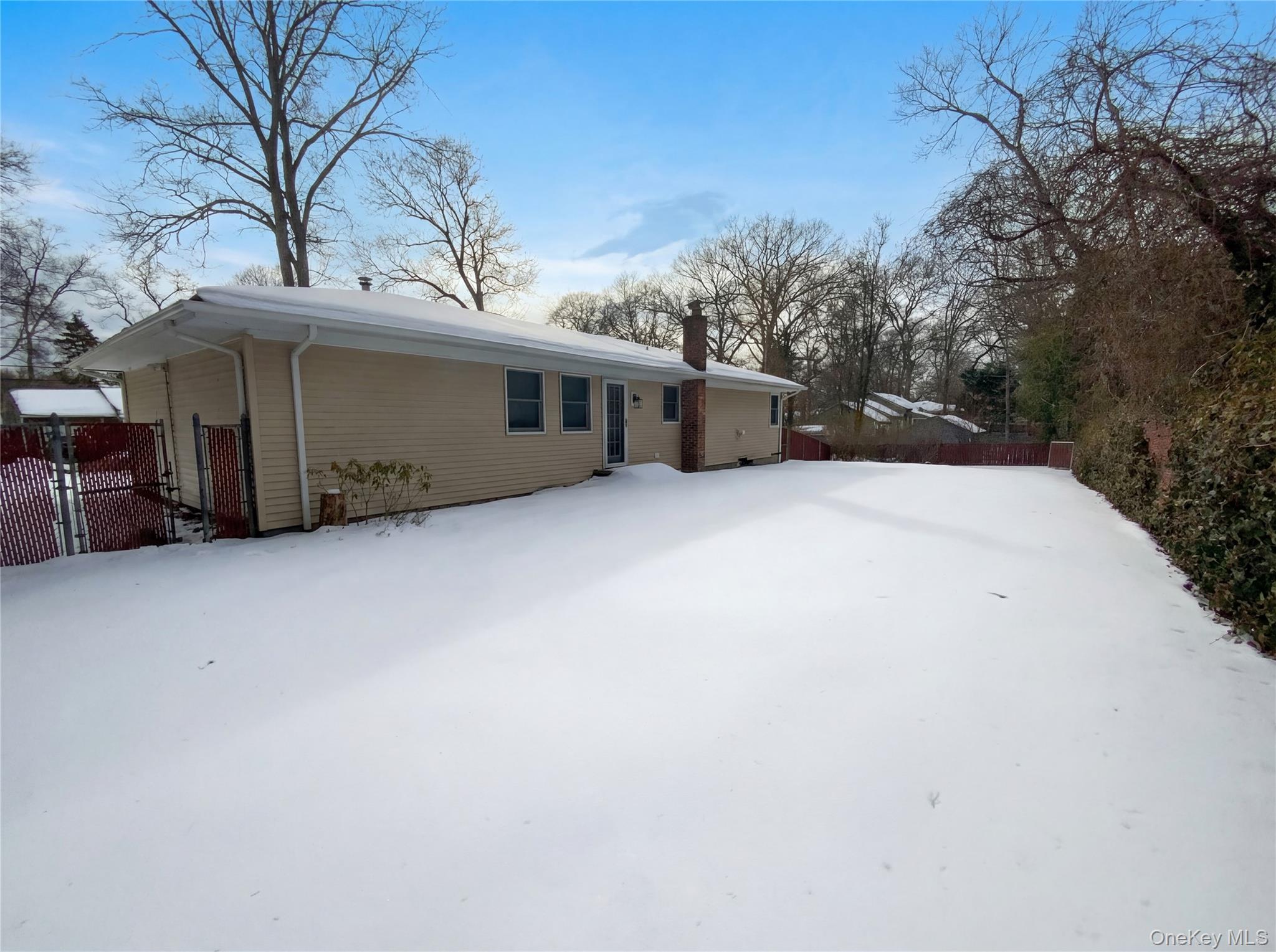 269 Prince Road Brookhaven, NY 11778 - Photo 21 of 22 a front view of a house with a yard and garage