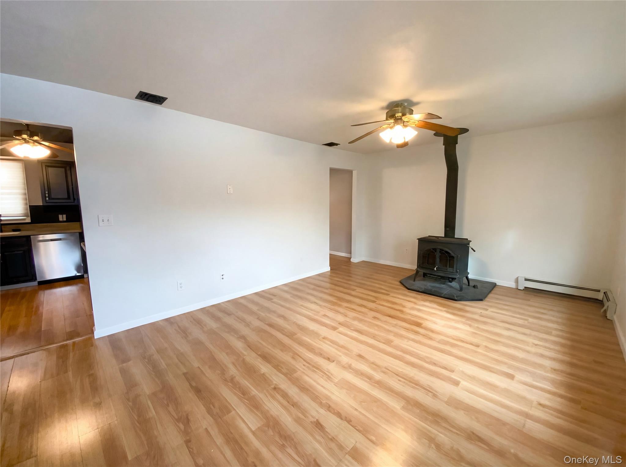 269 Prince Road Brookhaven, NY 11778 - Photo 3 of 22 a bedroom with a bed and a flat screen tv