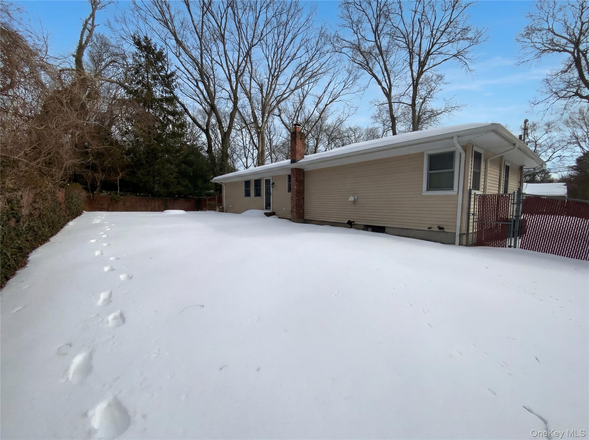 269 Prince Road Brookhaven, NY 11778 - Photo 5 of 22 a front view of a house with trees
