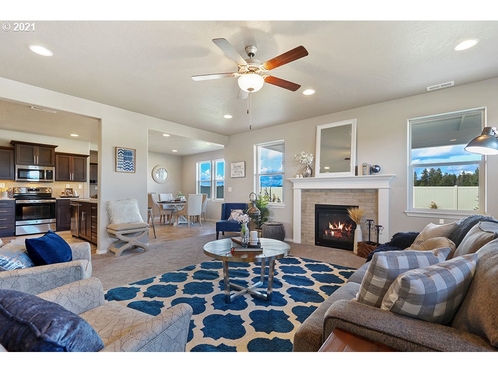 5021 Squirrel Street Springfield, OR 97478 - Photo 4 of 15 a living room with furniture and a fireplace