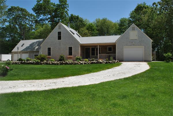 829 Division Road Westport, MA 02790 - Photo 8 of 15 a front view of a house with a garden and trees